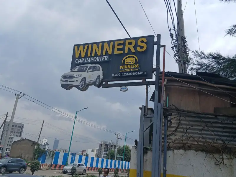 Winners Car Importer sign above the entrance